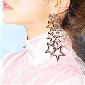 Statement stars Silvertone long earrings